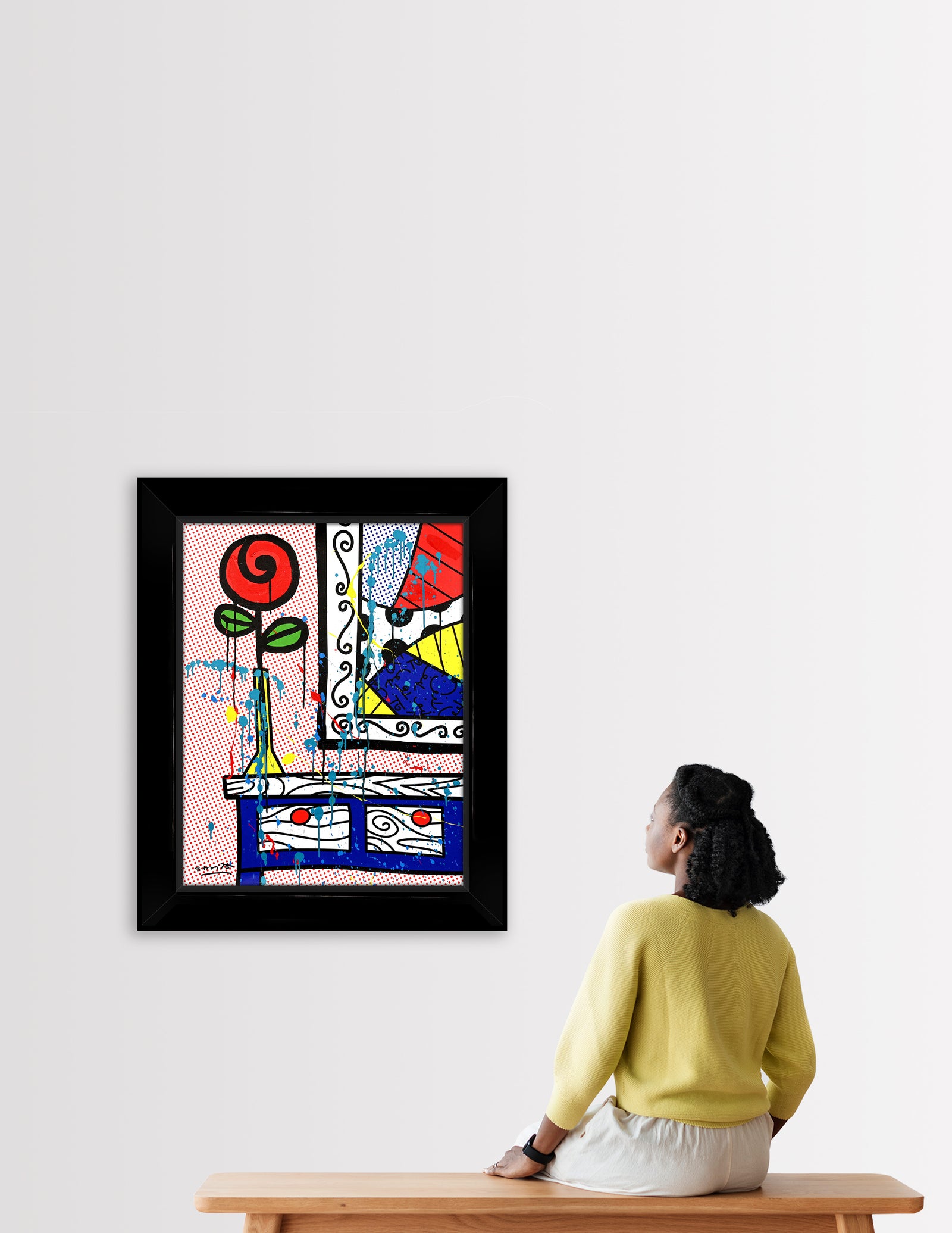 This image is a colorful, abstract artwork featuring a red rose on a night stand by a framed painting. The background includes a red tiny polka dots pattern against a white background. Bright colors such as blue, green, yellow, red, are used, with additional splashes of teal, red and yellow paint adding a lively touch to the art piece. mixed media original Romero Britto art Pop Art rose flowers girly simple