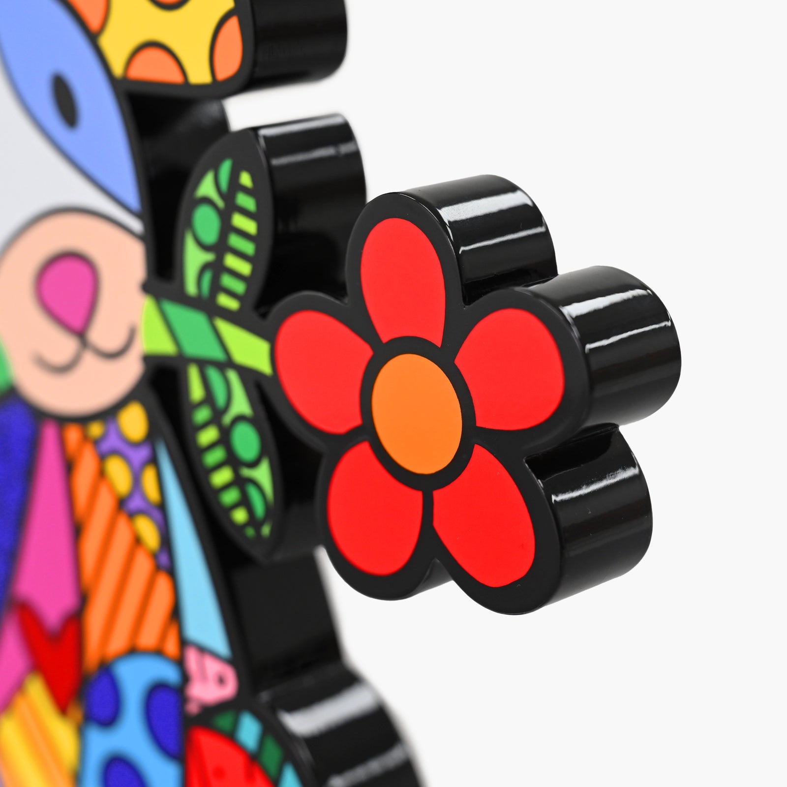 Close-up detail of Romero Britto Lovely Dog fine art sculpture showing texture and color