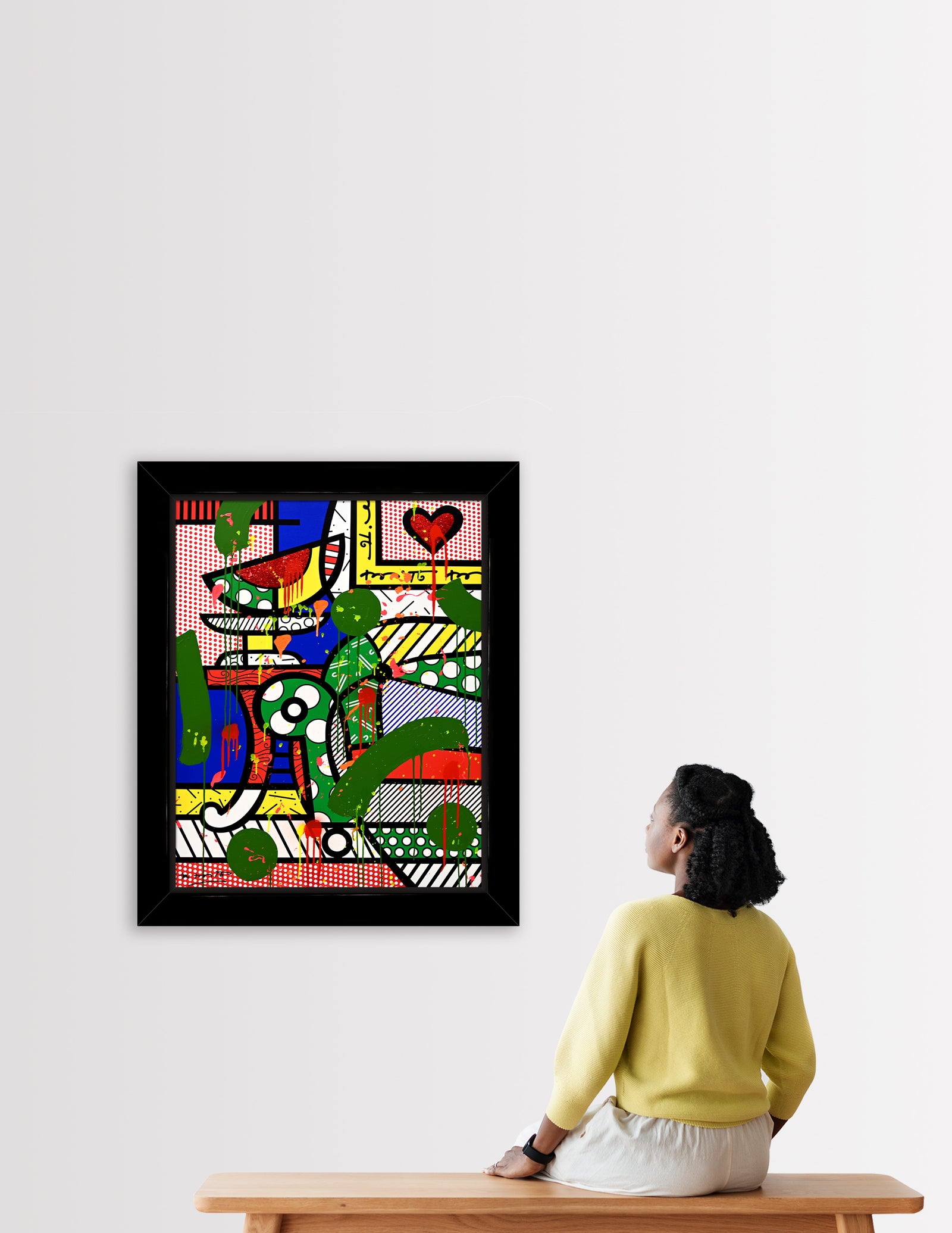   This image is a colorful, abstract artwork featuring a piece of a living room. The background includes deep blue wall, a stripped and polka dot background. Bright colors such as blue, green, yellow, red, are used, with additional splashes of , pink, orange, and yellow paint adding a lively touch to the art piece.   mixed media original Romero Britto art Pop Art home couch heart