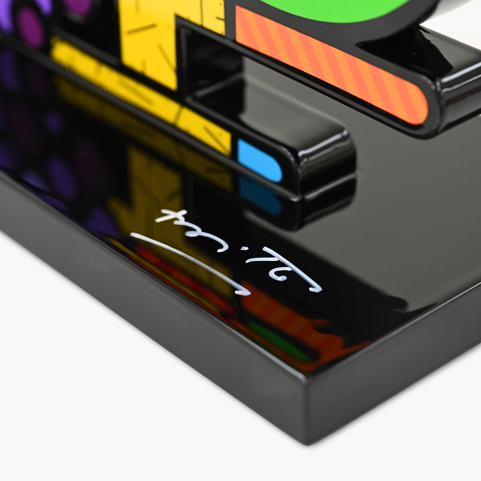 Hand signed signature on limited edition Fruit Bowl sculpture by Romero Britto