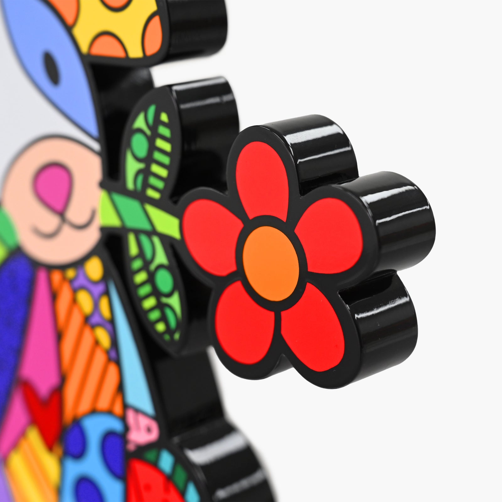 Close-up detail of Romero Britto Lovely Dog fine art sculpture showing texture and color